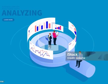 Businessman standing on magnifying glass analyzing data